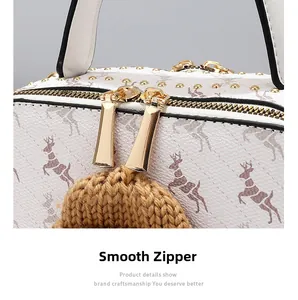 Close-up of golden smooth zipper and fawn print texture on vintage square bag