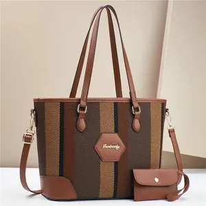 Classic striped tote bag set with brown leather accents and gold hardware