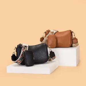 Litchi pattern saddle shoulder bag with wide geometric strap and mini coin pouch
