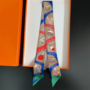 Elegant silk twilly scarf with colorful prints in a premium orange gift box