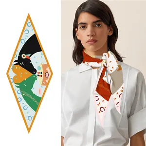 Detail of diamond-shaped silk scarf with horse prints on mannequin and flat layout