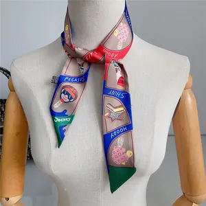 Detail of colorful twilly scarf with cartoon print styled on a mannequin neck