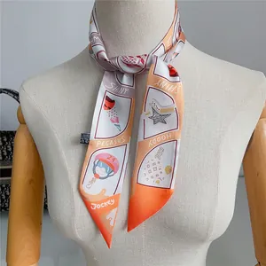 Detail view of a patterned twilly silk scarf tied on a mannequin neck for styling