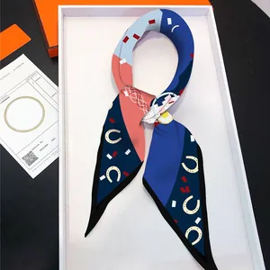 French style silk twilly scarf with heart and horseshoe patterns in an orange gift box