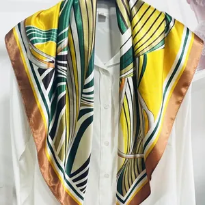 French style geometric striped large silk scarf draped over a white button-up shirt