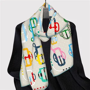 French style white scarf with colorful equestrian prints on a black knit sweater