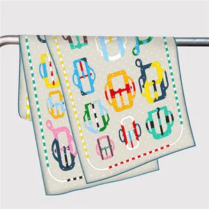 Detail of silk-like scarf with colorful buckle prints and fine hand-rolled edges