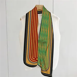French style twilly scarf with geometric stripes and polka dot edge on a vest