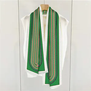 Detail of French striped silk scarf on hanger showing green pattern and satin texture