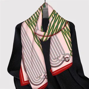 Detail of silk-feel scarf with equestrian horse motifs and red polka dot edge