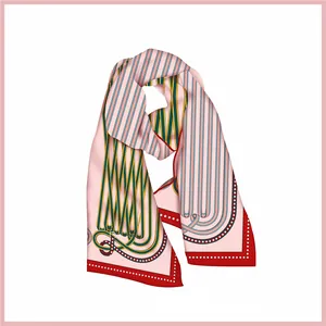 Detailed view of handmade silk scarf with geometric stripe patterns and red dotted edges