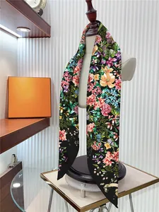 Detail of floral twilly silk scarf tied on mannequin with elegant rose prints