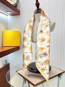 Detail of silk-like scarf with sunflower pattern on mannequin showing soft texture