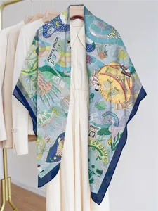 Detail of elegant silk shawl with marine theme illustration draped over a white dress