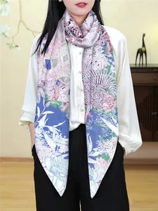Close-up of lightweight silk scarf with floral and European architectural patterns