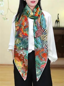 Detail of georgette shawl featuring a zebra print and vibrant jungle botanical pattern