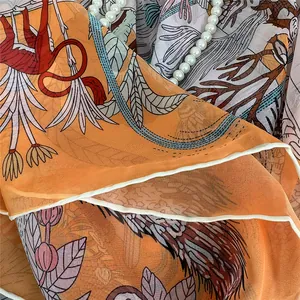 Detail of georgette shawl with vintage giraffe floral print and smooth fabric texture