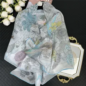 Floral chiffon scarf with giraffe and daisy prints on light grey background