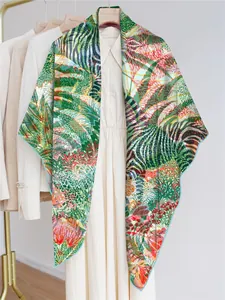 Close-up of georgette shawl featuring colorful jungle plants and floral botanical patterns