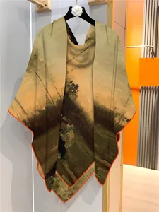 Detail of oil painting style scarf featuring a landscape print and vibrant orange hem