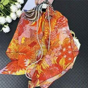 Chiffon scarf with tropical jungle and horse print displayed on luxury black background