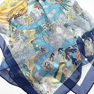 Detailed view of sheer Georgette scarf with ocean life print and coral illustrations