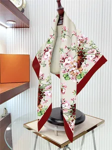 Detail of floral silk scarf on a wooden mannequin with elegant pink rose patterns