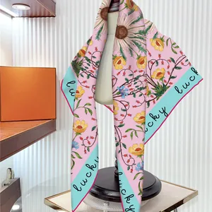 French floral sunflower print silk shawl with blue lucky script on pink background