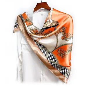 Close-up of a 90cm silk scarf featuring royal horse patterns and golden baroque details