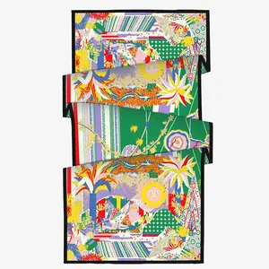 Long winter scarf for women featuring surrealist floral and sun patterns in rich silk texture