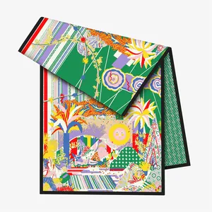 Close-up of artistic floral silk scarf with sun motif, palm trees and black hemmed edges