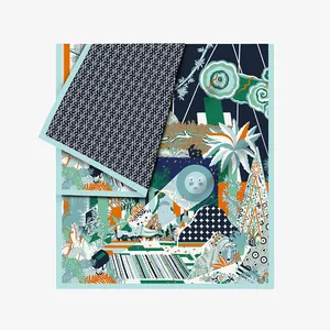 Detail of artistic floral silk scarf showing tropical patterns and fine rolled edges