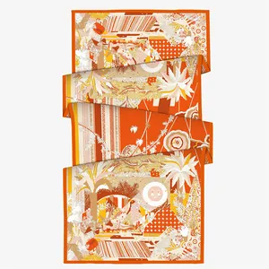 Luxurious orange silk scarf with tropical palm and sun pattern for stylish winter layering