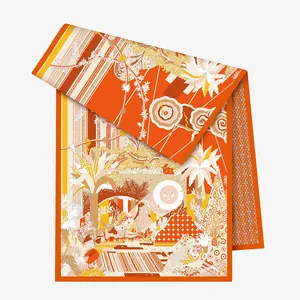 Detail of artistic floral and wildlife silk scarf with orange tones and tropical motifs