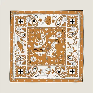 Close-up of silk scarf showing western horse, cowboy hat and paisley pattern details