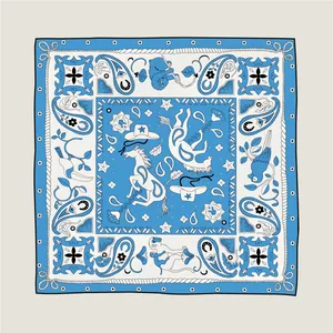 Detail of blue cashew unicorn silk scarf with western paisley horse and star patterns