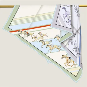 Detail of horse racing print silk scarf draped over a gold rod showing fabric texture