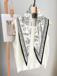Detail of nautical sailboat silk scarf with Neptune motif on a wooden hanger
