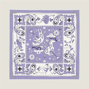 Detailed pattern of silk scarf showing animal illustrations and rolled edge