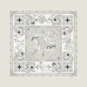 Detail of silk scarf with vintage paisley, horses, and cowboy hat illustrations