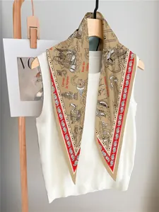 Detail of vintage nautical print silk scarf with sailing ships and paisley border