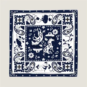 Detailed pattern of navy and beige square silk scarf featuring horse and rope design