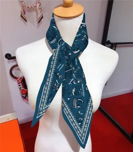 Close-up of nautical silk twilly scarf with sailboat and sea monster pattern