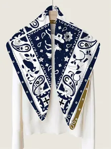 Close-up of hand-rolled edges and intricate twill silk scarf print with western motifs