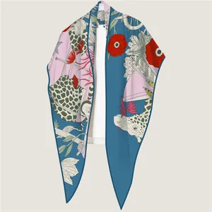 Women's silk scarf featuring giraffe and floral prints with soft lake blue and pink tones