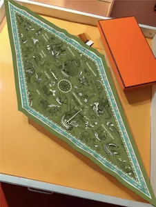 Close-up of olive green nautical diamond silk scarf with sail and mermaid illustrations
