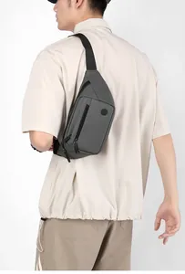 Detail of dark grey waterproof nylon waist bag with fashion patch and adjustable strap