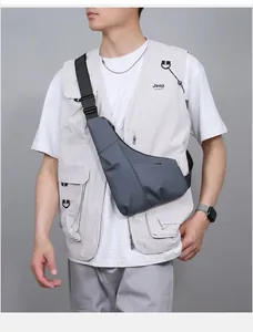 Detailed view of the dark grey waterproof crossbody bag with adjustable nylon strap