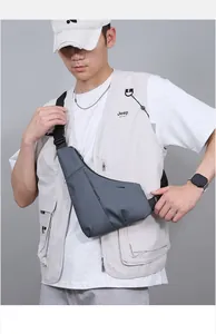 Detailed view of the ergonomic adjustable shoulder strap and buckle on the men's chest bag
