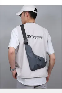 Macro view of men's slim chest bag with waterproof matte texture and adjustable strap
